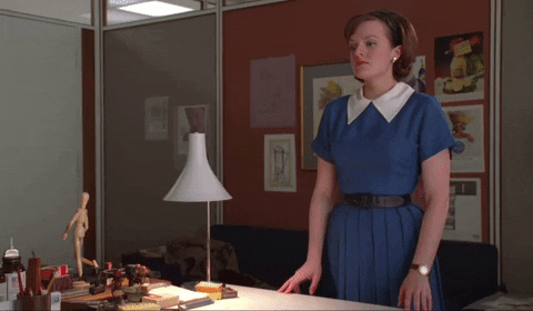 Peggy Olson Bangs Head Against Wall GIF