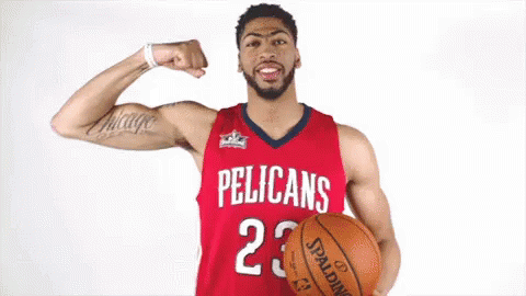 Pelican Basketball Player Flexing Muscles Holding Spalding Basketball