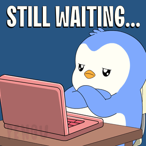 Penguin At Desk With Laptop Still Waiting GIF