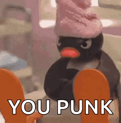 Penguin in Pink Hat Sitting on Toilet