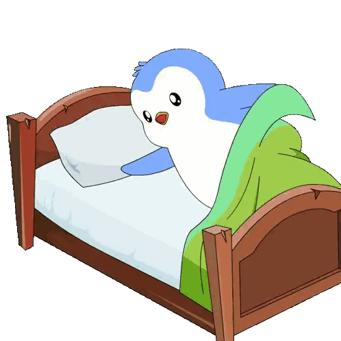 Penguin Lying on Bed with Green Blanket