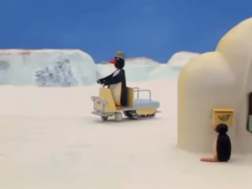Penguin Riding Snowmobile