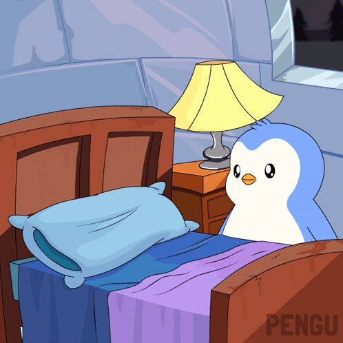 Penguin Sitting on Bed Next to Lamp
