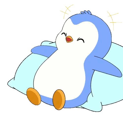 Penguin Sitting on Blue Pillow
