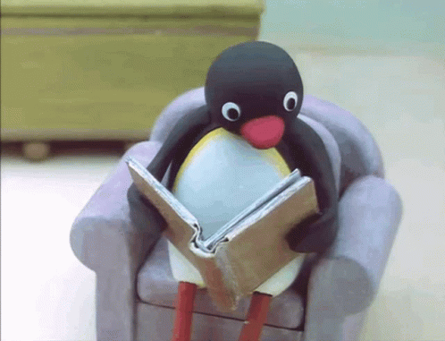 Penguin Sitting on Chair Reading Book