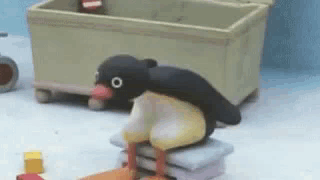 Penguin Sitting on Pillows