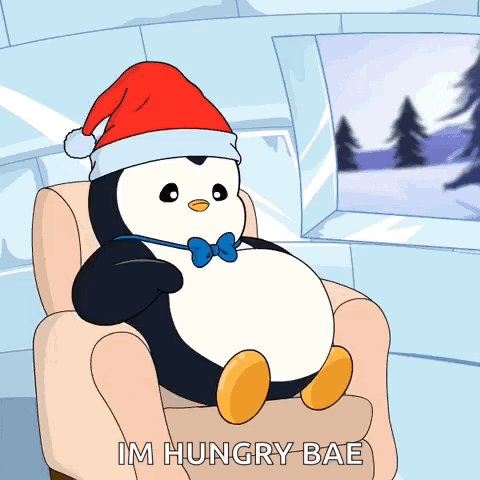 Penguin Sitting With Santa Hat And Bow Tie GIF