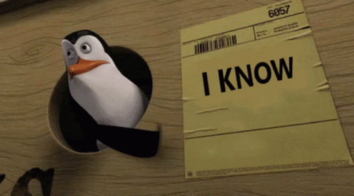 Penguin Sticking Head Out of Paper Hole