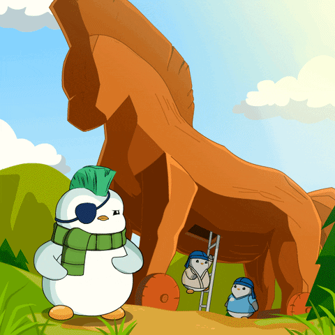 Penguin With Mohawk and Scarf in Front of Wooden Horse Statue