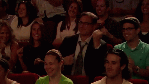 People Applauding Show in Theater