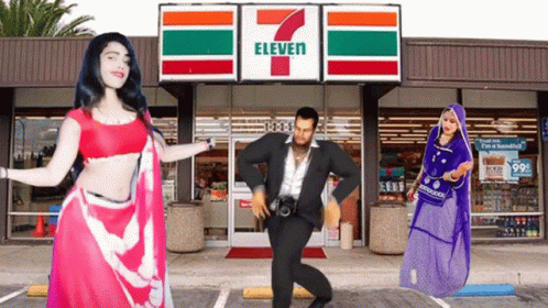 People Are Dancing In Front Of A 7 Eleven GIF