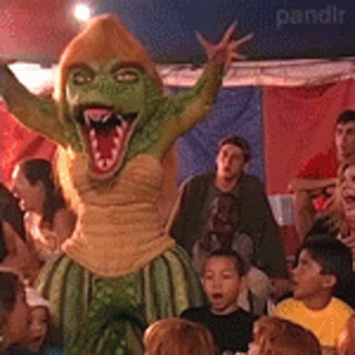 People Around Green Monster Mascot