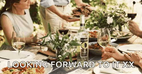 People At Table With Bottle Looking Forward To It XX GIF