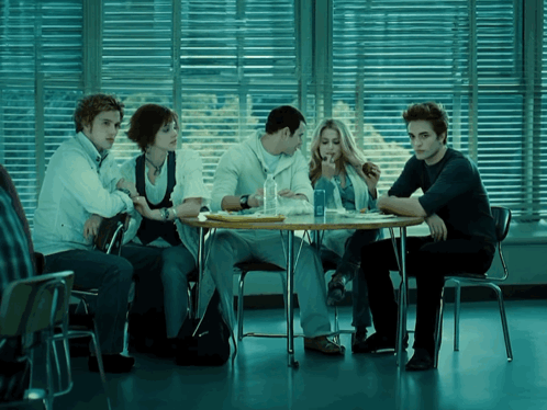 People At Table With Coca Cola Bottle