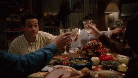 People At Table With Food And Wine GIF