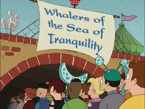 People at Whalers of Sea of Tranquility Sign