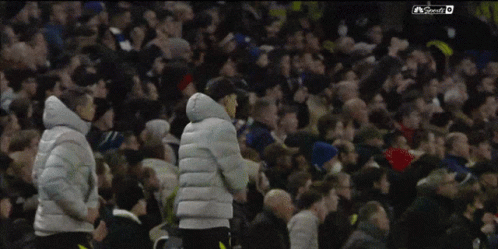 People Celebrating in Front of Crowd