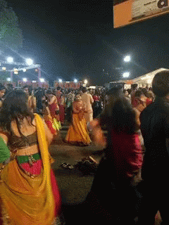 People Dancing By Aa Sign