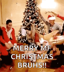 People Dancing in Front of Christmas Tree