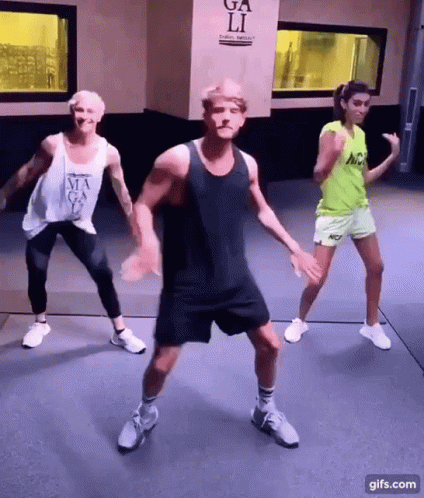 People Dancing In Front Of Ga Li Sign GIF