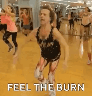 People Dancing in Gym with Feel The Burn Costume