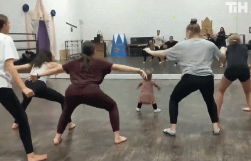 People Dancing In Room With Th Letters GIF