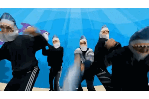 People Dancing in Shark Masks