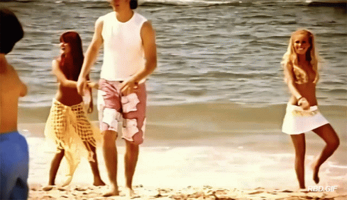 People Dancing On Beach Saying Red GIF