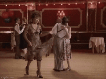 People Dancing On Dance Floor In Red Room GIF