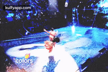 People Dancing on Stage in Front of Crowd Colors