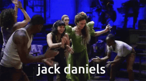 People Dancing on Stage with Jack Daniels