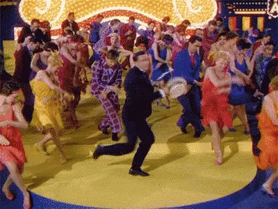 People Dancing with A Sign