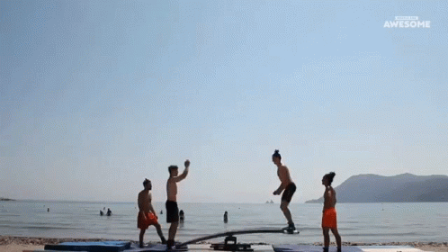 People Doing Trick on Seesaw at Beach Awesome