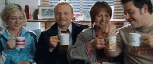 People Drinking Coffee and Smiling
