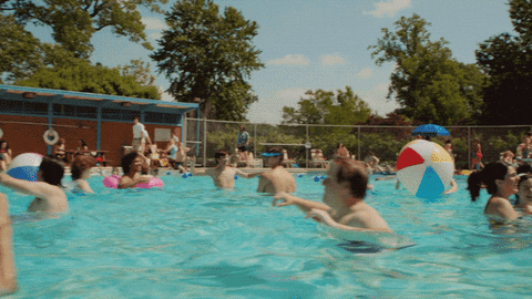 People Enjoying Summer Pool Party GIF
