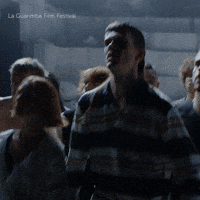 People Gathered Dark Room La Guerre Film Festival GIF