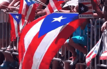 People Holding Flags And 4 Boricua Sign GIF