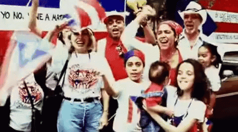 People Holding Flags and Baby by Car