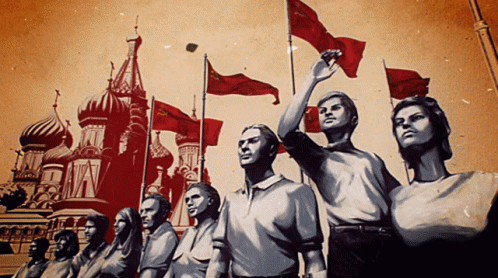 People Holding Red Flags Near Building With A GIF