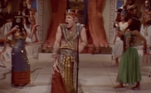 People in Ancient Egyptian Costumes Dancing