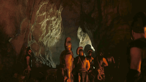 People in Cave With Helmets and Armor