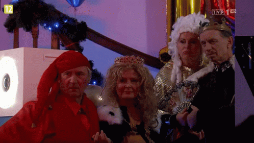 People In Costumes In Front Of TV Screen Saying TVP 1 KC GIF