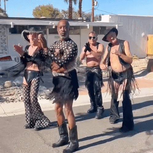 People In Cowboy Boots On Street GIF