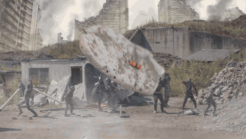 People in Front of Building with Huge Explosion