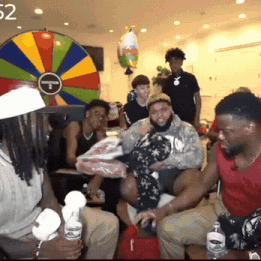 People In Front Of Colorful Spinning Wheel 52 GIF