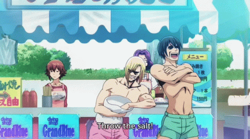 People in Front of Grand Blue Sign