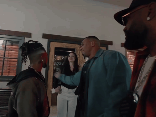 People In Front Of Rider Sign GIF