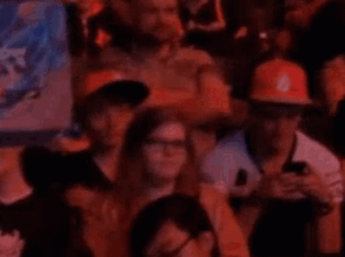 People In Stadium Watching Game On Phones GIF