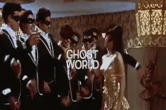 People in Suits and Masks Dancing