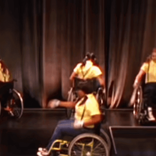 People In Wheelchairs Performing On Stage GIF